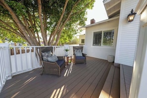 Enjoy the outdoors on our serene patio. Private deck overlooks the neighborhood and makes for a great place to take tea in the morning sunrise, or wine with the sunset. This Patio also overlooks the lush landscape of the front terrace.