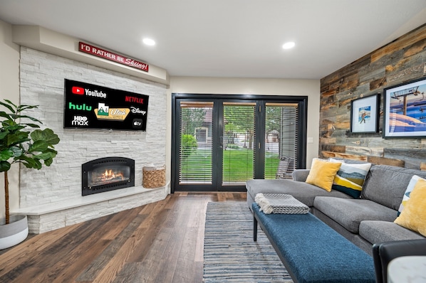 Enjoy the cozy living room, with plush seating and expansive Smart TV.