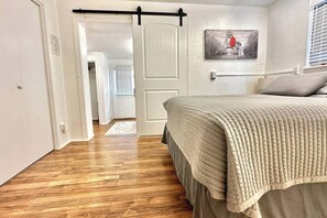 The second bedroom with sliding door to the first bedroom shown
