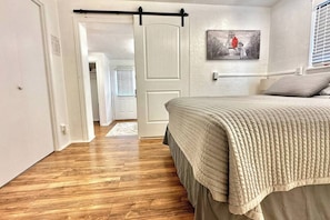 The second bedroom with sliding door to the first bedroom shown