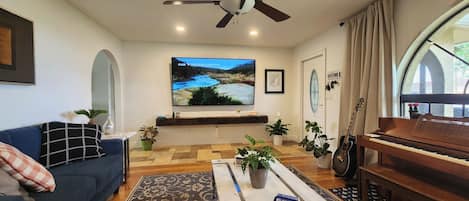Spacious living room for movies, garden views, or making music.