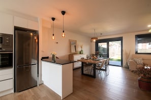 Kitchen or kitchenette,Living room,Floor plan,Dining area,Garden view