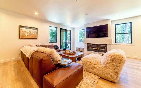 Gorgeous living room overlooking Sierra Star Golf Course and pine tree forest.