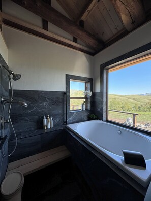 Soak in the deep tub with a stunning Mountain View.