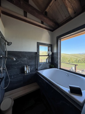 Soak in the deep tub with a stunning Mountain View.
