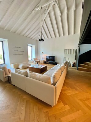 Lounge w/ view of the staircase that leads to the gym at the mezzanine