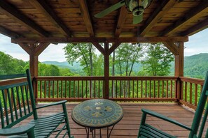 Start your morning with coffee or end your day with a glass of wine at this cozy balcony nook — complete with comfy seating and a charming table.