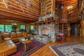 Gather, unwind, and connect in this beautifully open living space, complete with a crackling fireplace and mountain charm.


