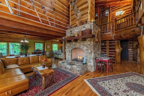 Gather, unwind, and connect in this beautifully open living space, complete with a crackling fireplace and mountain charm.