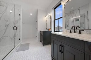 Self-care starts here—enjoy a luxurious soak or an invigorating shower with premium toiletries