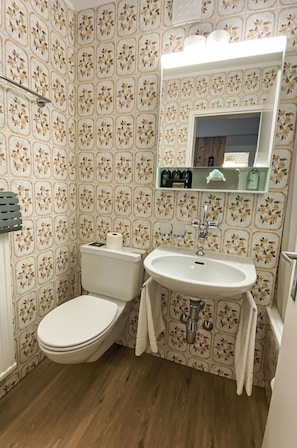 Flooring, Plumbing Fixture, Interior Design, Floor, Toilet Seat, Bathroom, Bathroom Sink, Plumbing, Tile, Toilet