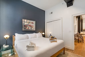Primary bedroom featuring a King bed, closet, and dresser.