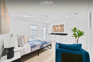 Minimalist haven: where comfort meets modern simplicity.