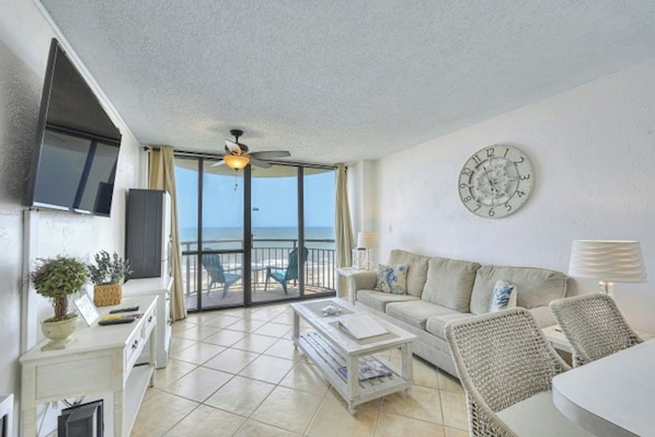 The ocean front living room is well-appointed with comfortable furnishings.