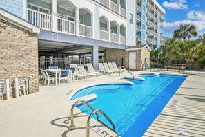Take a cool dip in the sparkling pool after a fun day at the beach.