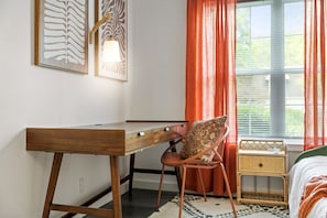 Bedroom 4 offers a dedicated workspace