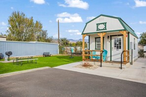 A photo of cabin 4 and the turf area beside it