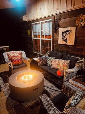 Outdoor sitting area with gas fire pit for cool warnings with your coffee.