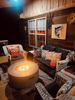Outdoor sitting area with gas fire pit for cool warnings with your coffee.