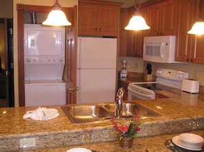 Washer and dryer in storage closet in Grand kitchen