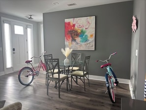 Dining Room: Vibrant space with artistic decor and fun bikes for exploring Greenville!