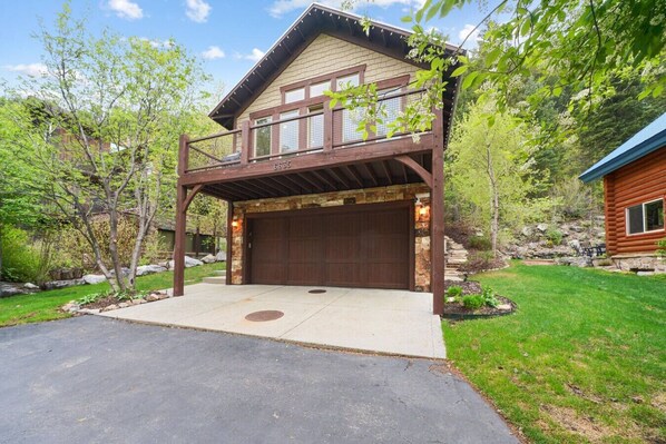 Welcome to your perfect getaway in the mountains! This beautiful cabin features rustic stone and wood finishes, a spacious balcony, and is surrounded by lush trees for a peaceful, private feel.