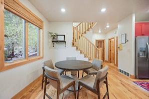 Enjoy meals in a bright dining area with stunning views of the surrounding nature.
