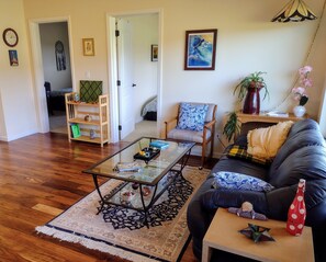 Central area for hanging out, dining, and watching movies on the lg. Smart TV.