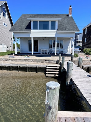 Sand bunker for the littles to play in. Swim area Walk in or jump off the dock