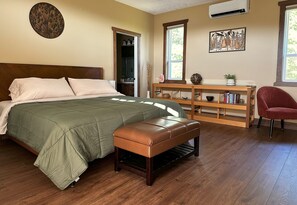 Primary Bedroom: King-size bed, ensuite bathroom, ocean views, access to balcony