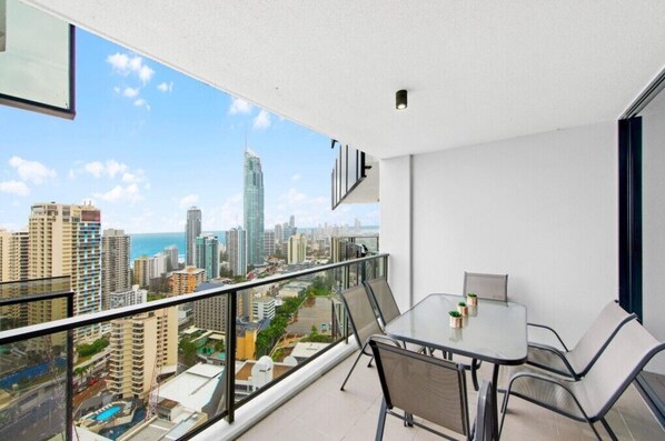 Relax and enjoy stunning ocean and city views from your balcony.
