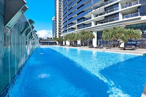 Relax by the stunning outdoor lagoon pool, complete with cascading water features and lush surroundings.
