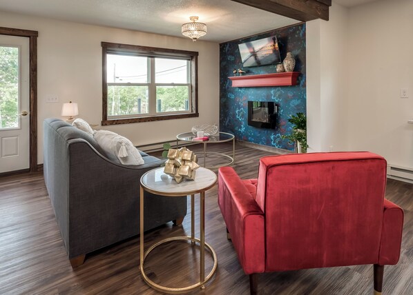 Living Room with Queen Pull Out Sofa, TV, Electric Fireplace