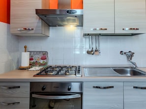 Kitchen Appliance, Kitchen, Countertop, Kitchen Stove, Major Appliance, Stove, Cabinetry, Kitchen Sink, Gas Stove, Home Appliance