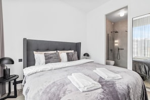 Master bedroom with a king size, 5 star mattress, ensuite bathroom and a 55" TV