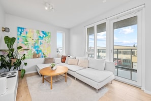 Our calming living area directly connects you to the fully furnished balcony