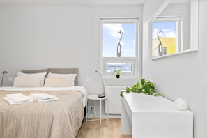 Indulge in comfort and simplicity as you relax to our cozy master bedroom, furnished with a plush king bed and just the essentials for a restful stay