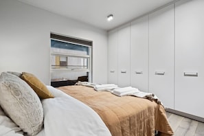 Enjoy the convenience of a built-in private bathroom in our stylish master bedroom.