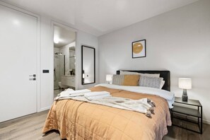 Unwind in luxury in our cozy master bedroom with a built-in private bathroom.