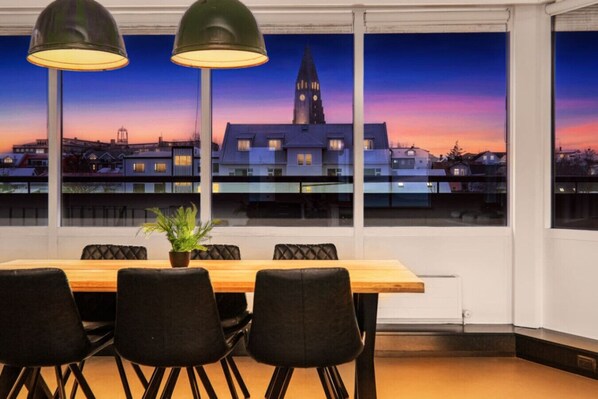 The dining area features large windows that offer a stunning view.