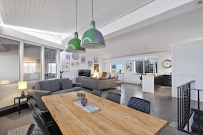 The dining area features a dining table with seating for 6.