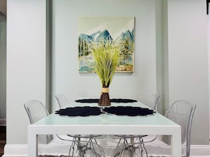 Dining table with 4 chairs that also serves a a working space.
