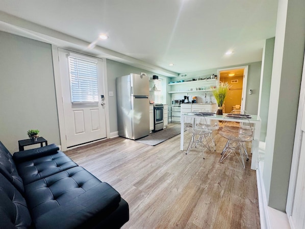 Living space with kitchen, dining and living room.