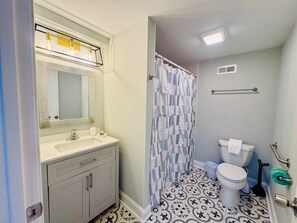 Full Bathroom with shower/tub combination. 