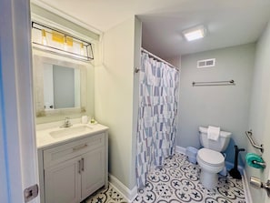 Full Bathroom with shower/tub combination.