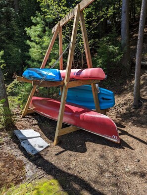 Boat rack, with 1 canoe, 2 kayaks, 1 paddle board - available for Guest use.