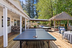 Huge deck offers sun, shade, tables seating 16+ and Ping Pong!
