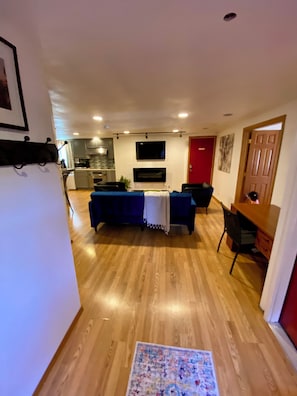 Open concept living room with easy access to kitchen area.