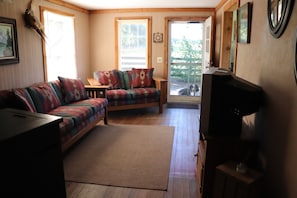 living room. looking outside - farm dog Jake patiently waiting