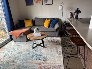 Once you enter the living room you'll find a space that feels both luxurious and cozy, perfect for unwinding after a long day.